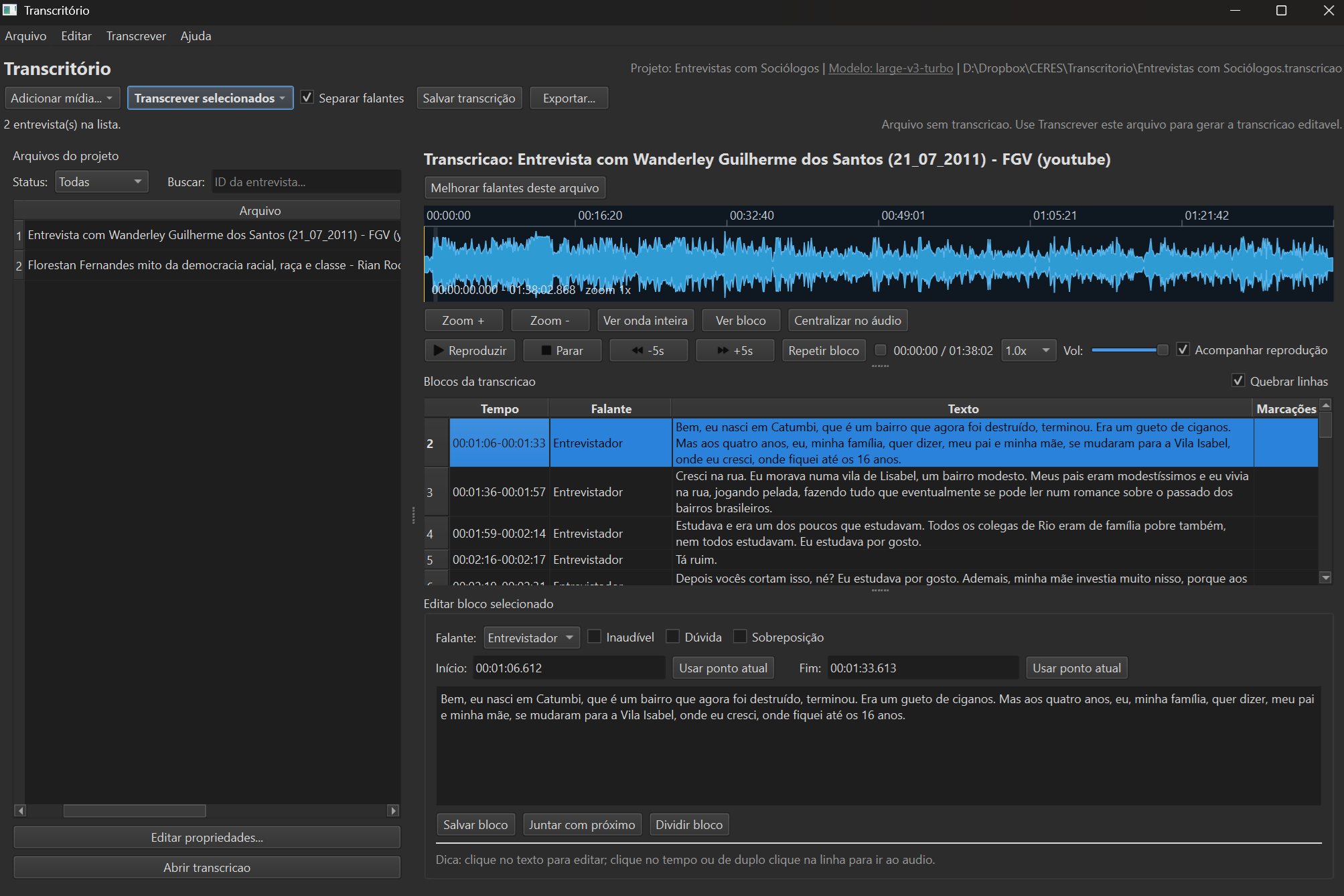 Transcritório main screen showing waveform, turn table with interviewer and respondent, and block editor.
